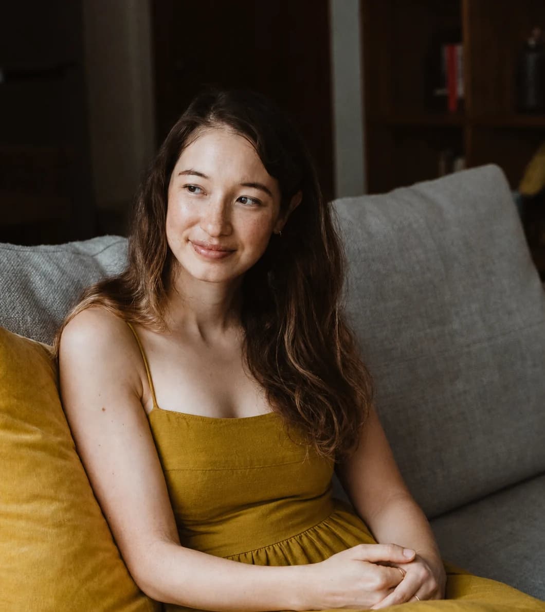 Alexandra Colgan seated, looking towards the camera.